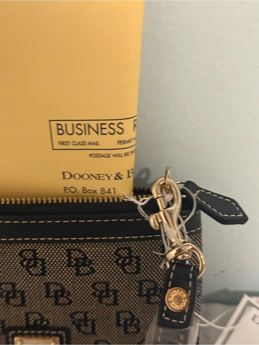 Dooney and Bourke NWT Medium logo wristlet. Comes in a box!